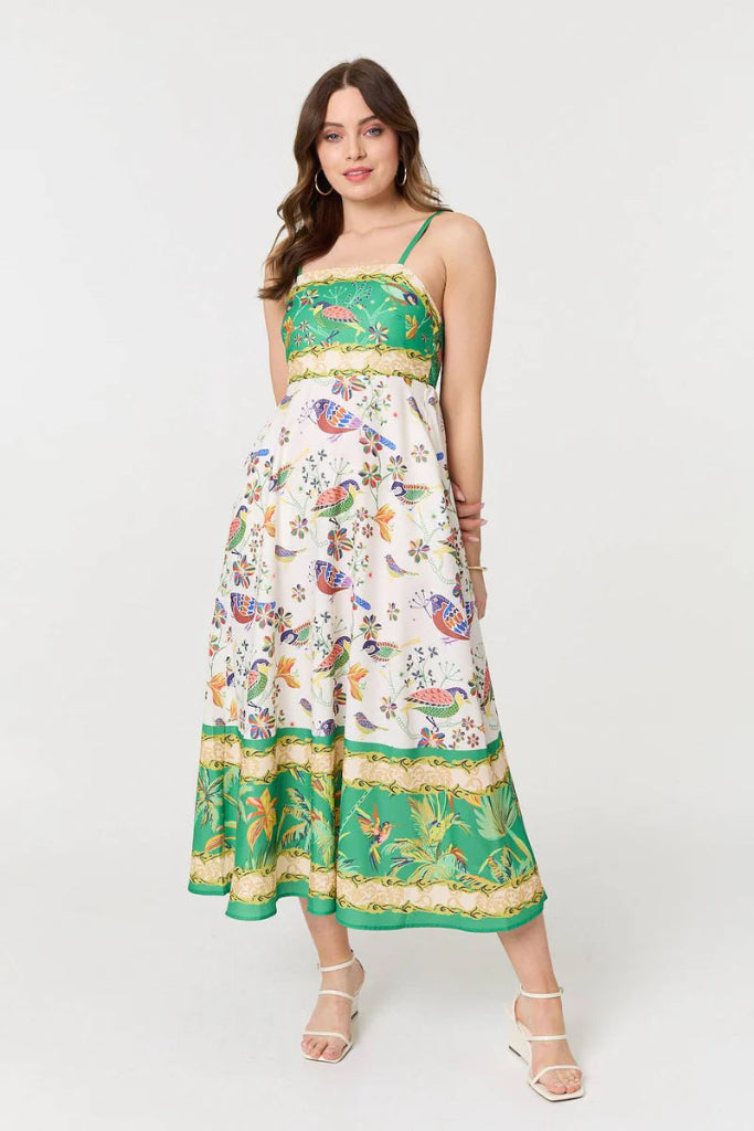 Woman wearing a Stella Morgan D733248 Dress  floral dress with green accents on a white background