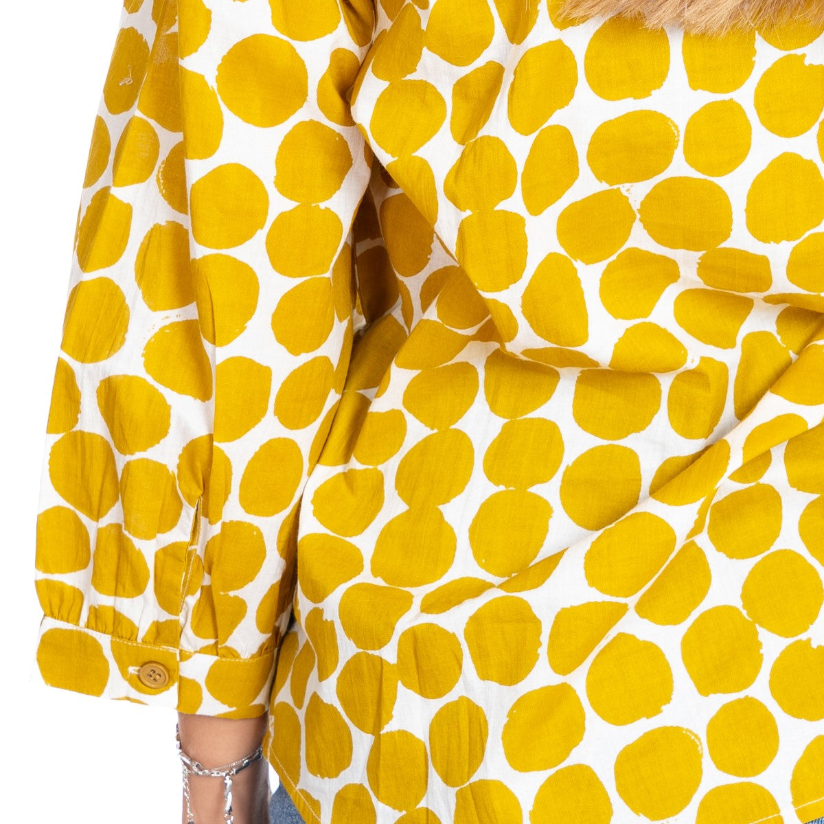Close-up of a yellow and white patterned fabric