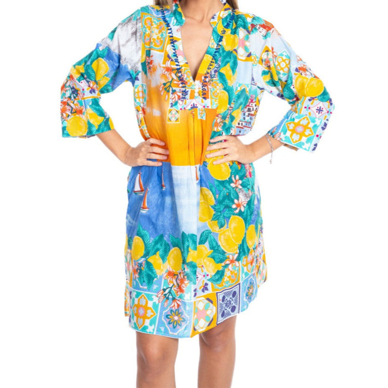 Woman wearing a colorful floral dress with a white background