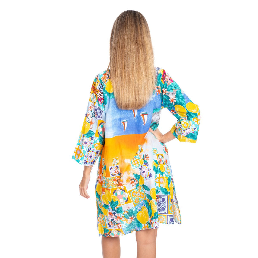 Woman wearing a colorful floral dress with a white background
