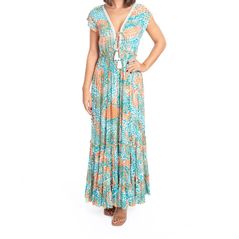 Woman wearing a patterned dress on a white background