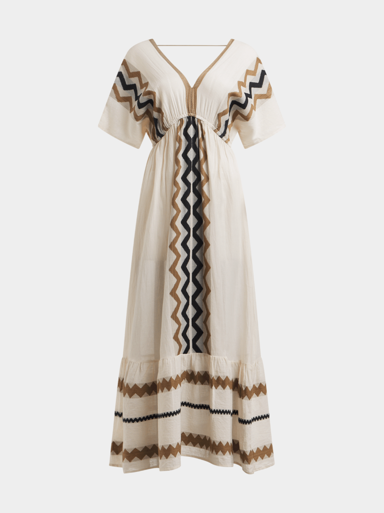 Beige dress with black and brown zigzag patterns on a white background