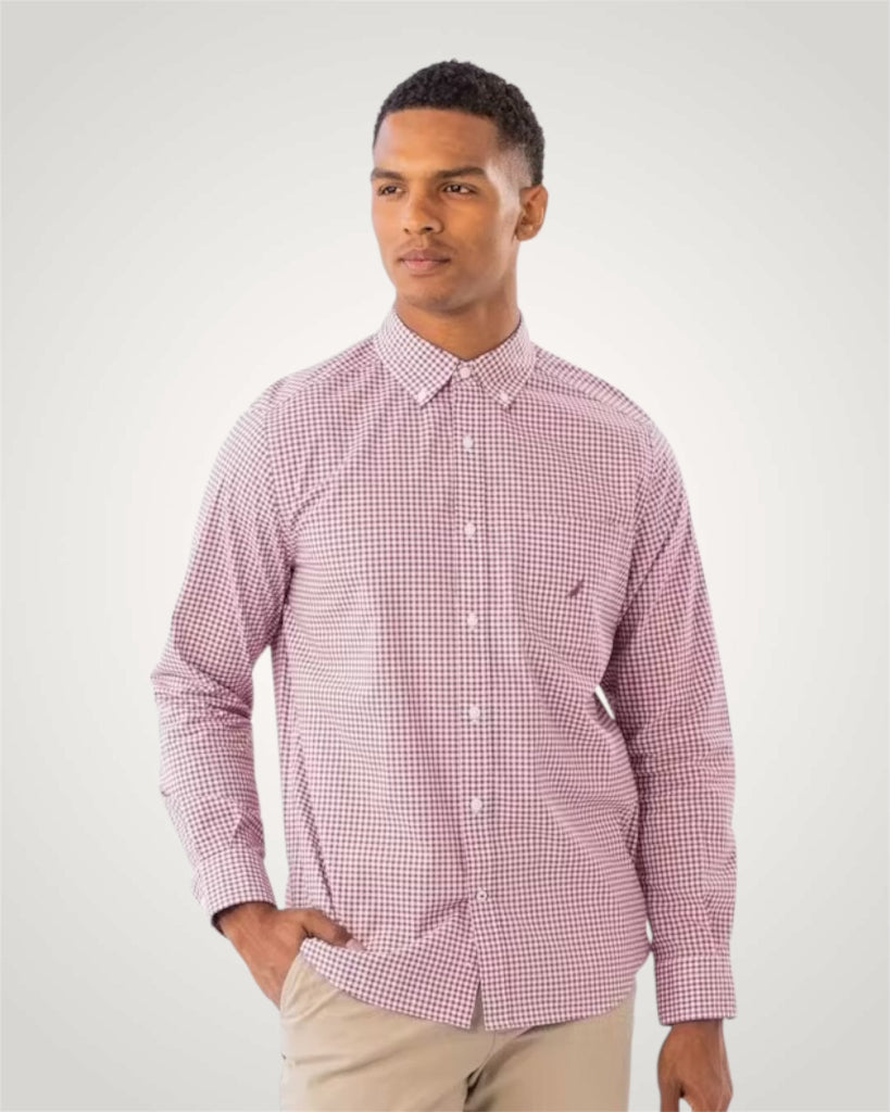 Man wearing a red and white checkered shirt against a plain background