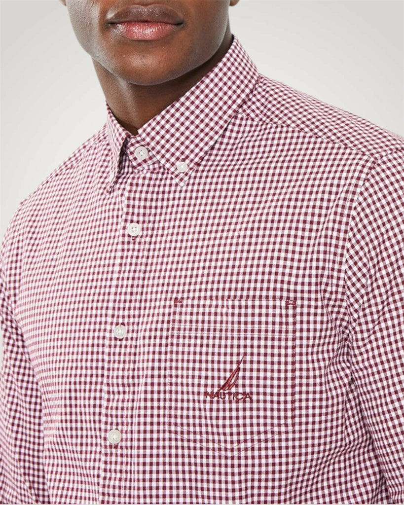Red and white checkered shirt with a logo on a gray background red gingham button down shirt