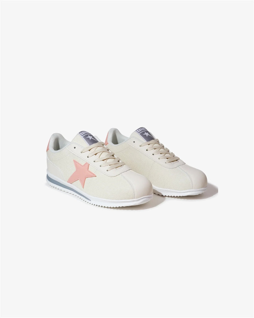 Pair of light-colored sneakers with a pink star design on a white background