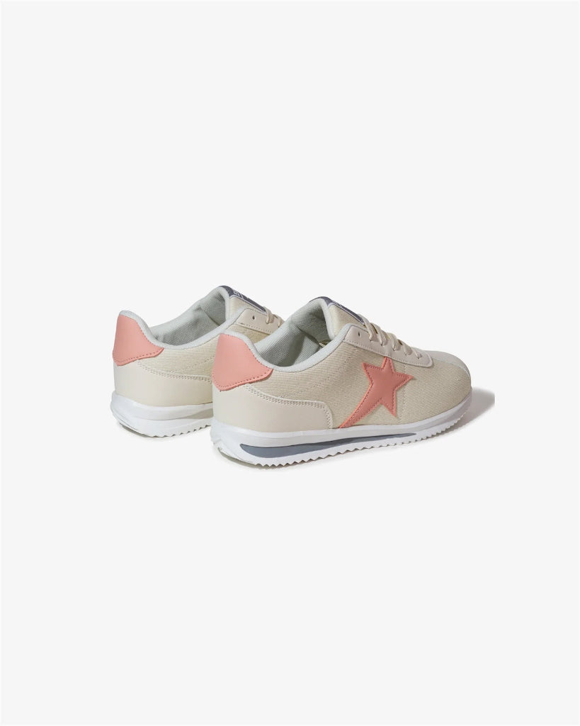 Pair of beige sneakers with pink accents on a white background