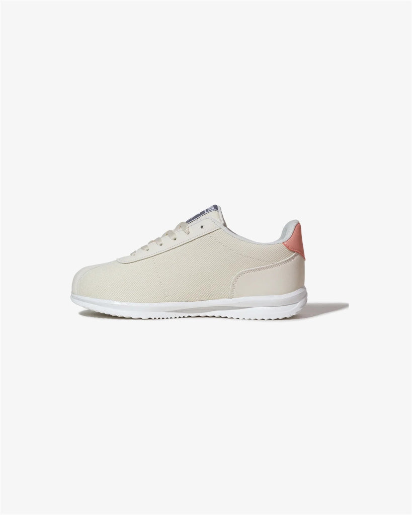 Beige sneaker with pink heel on a white background