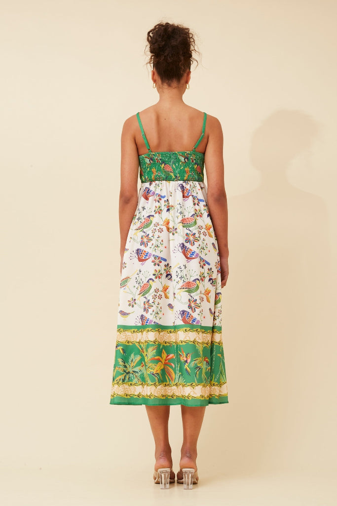 Woman wearing a Stella Morgan D733248 Dress floral dress with green accents on a beige background