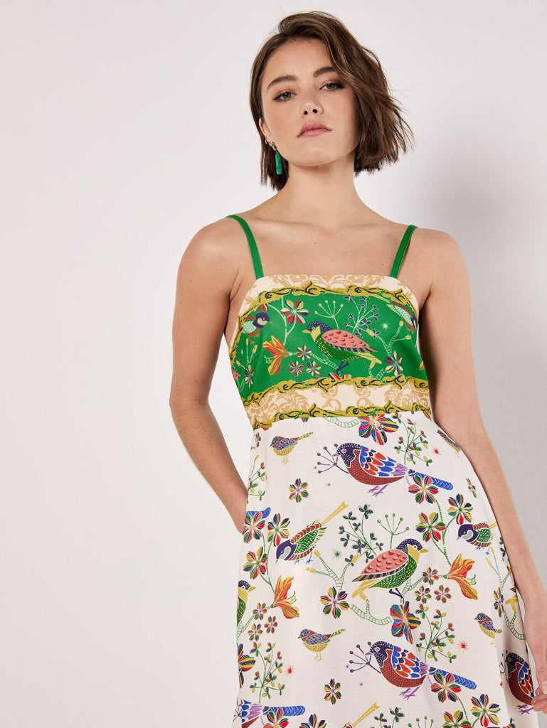 Woman wearing a Stella Morgan D733248 Dress  colorful floral dress with green straps on a white background