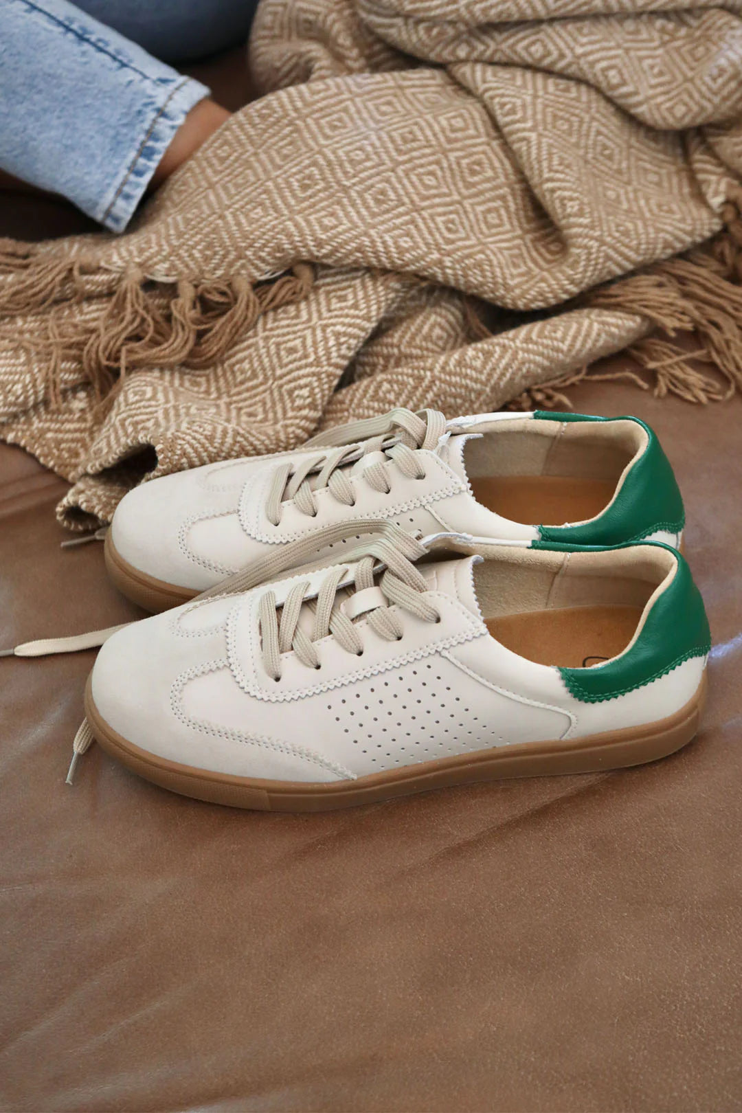 top view cream leather lace up sneaker shoe with green heel detail