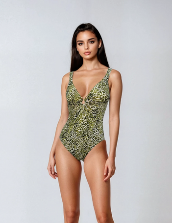 Woman wearing a green leopard print swimsuit on a white background