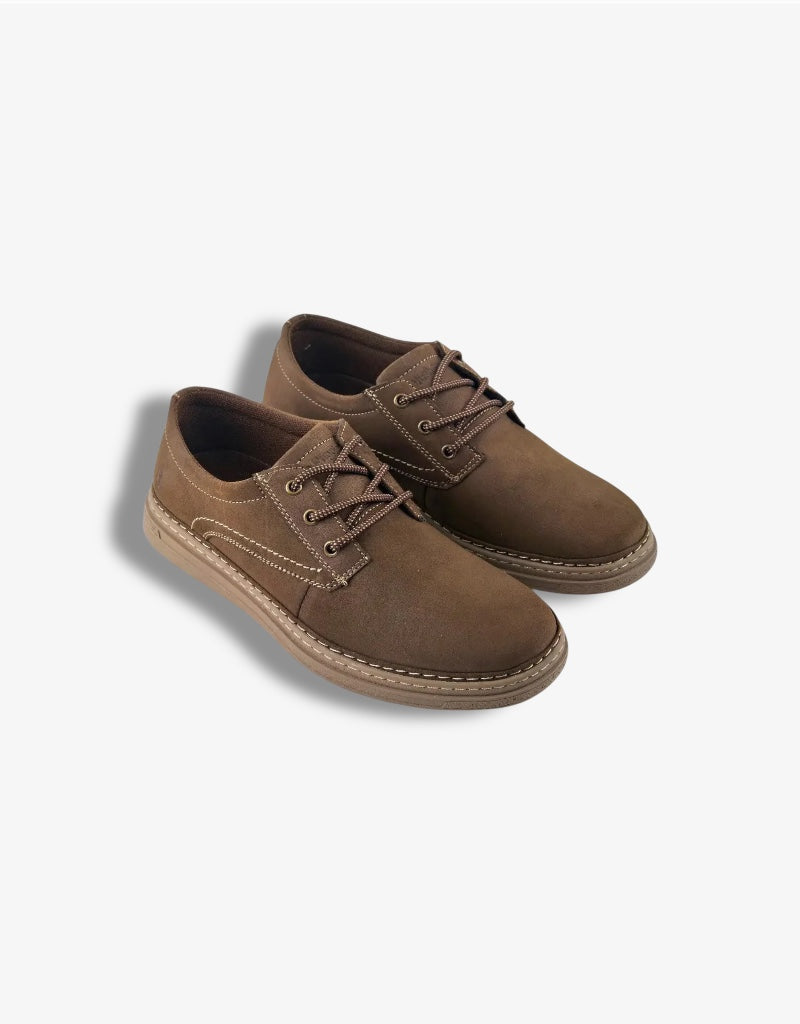 Pair of brown suede shoes on a white background