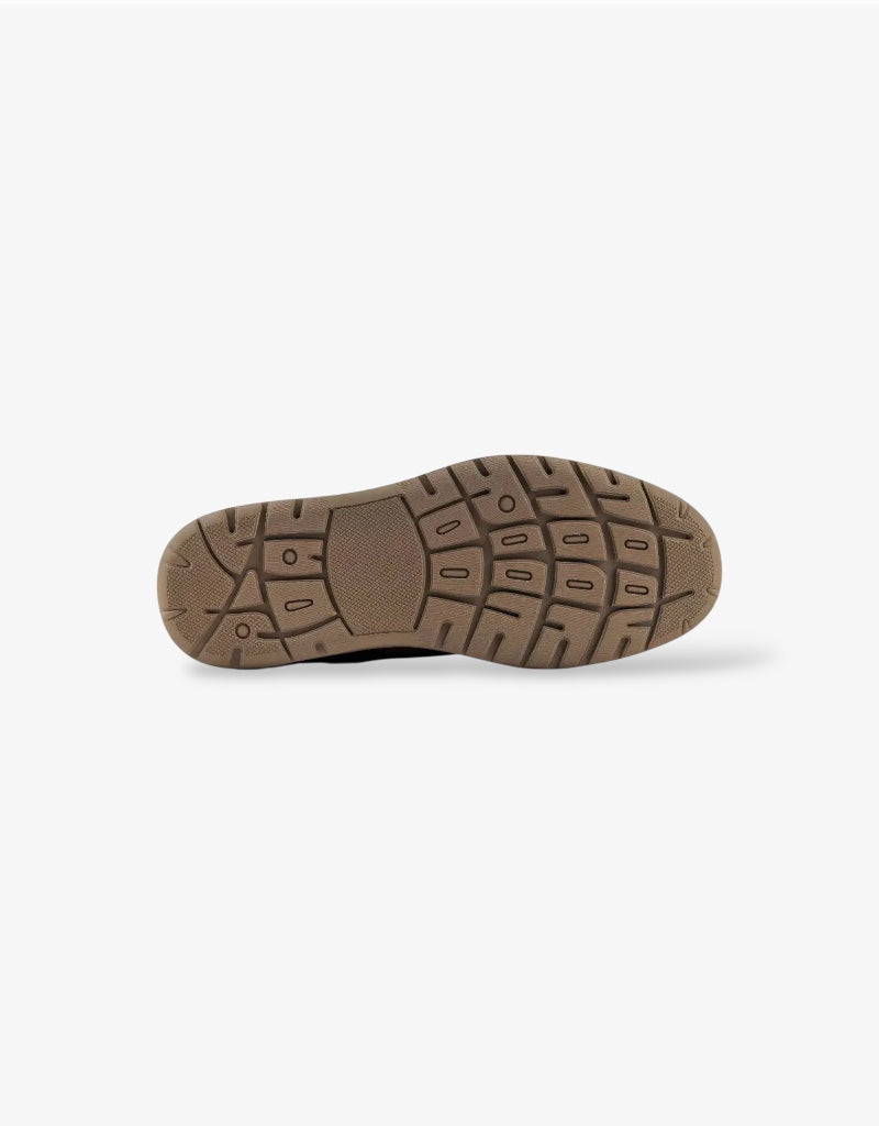 Close-up of a brown shoe sole on a white background