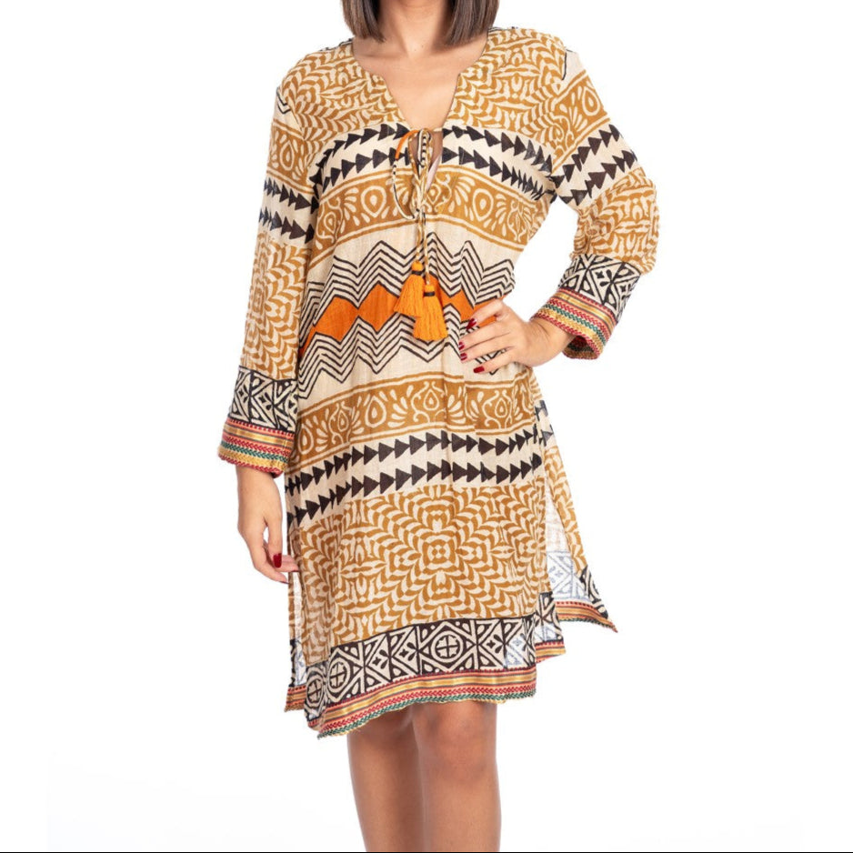 Woman wearing a patterned dress on a white background