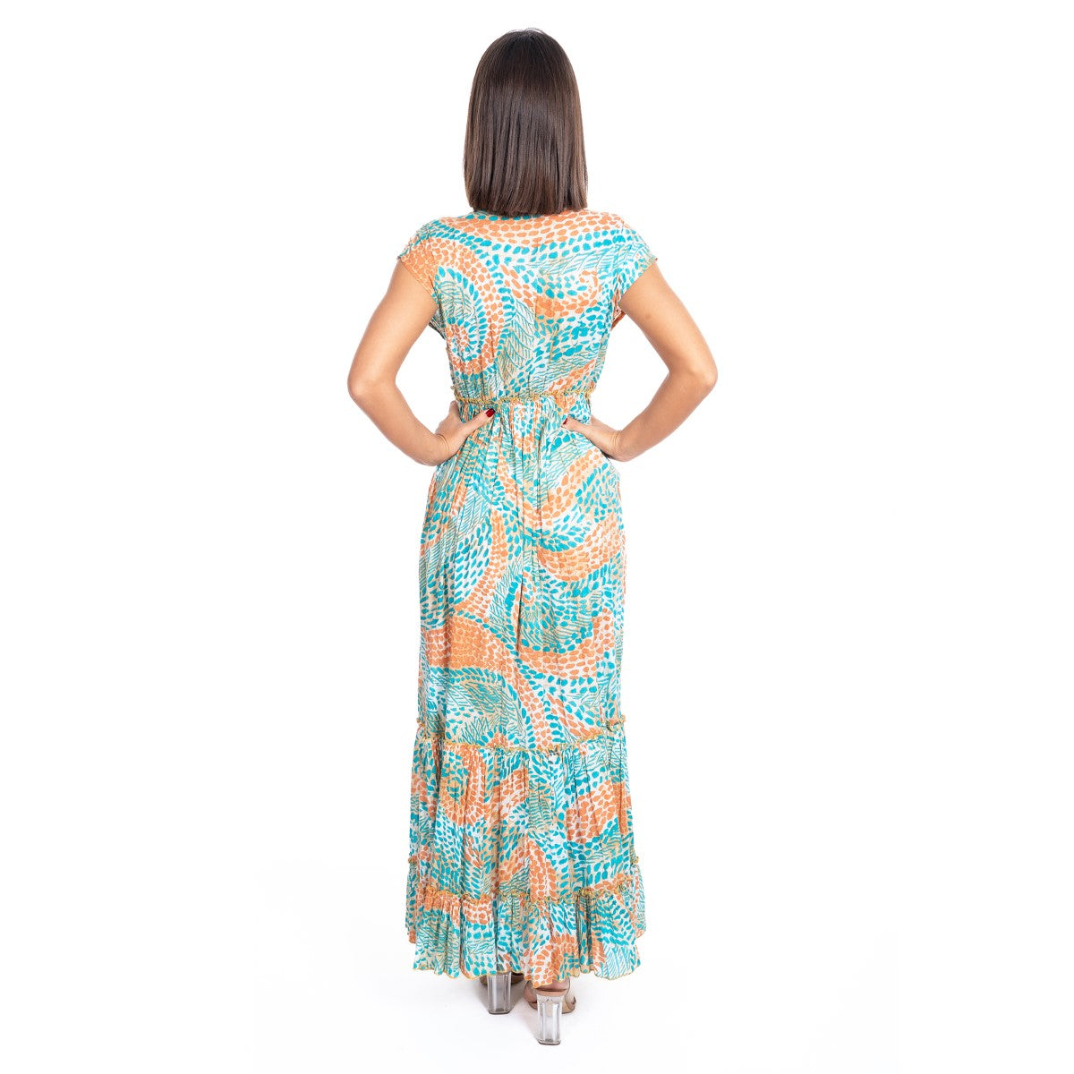 Woman wearing a patterned dress on a white background