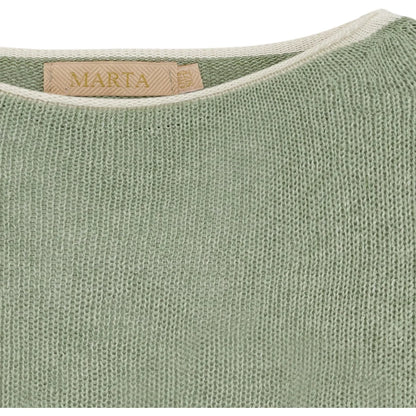 Close-up of a green fabric with a 'Marta' label on a white background
