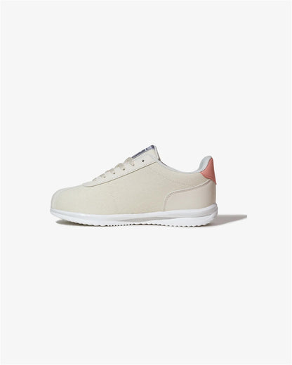 Beige sneaker with pink heel on a white background
